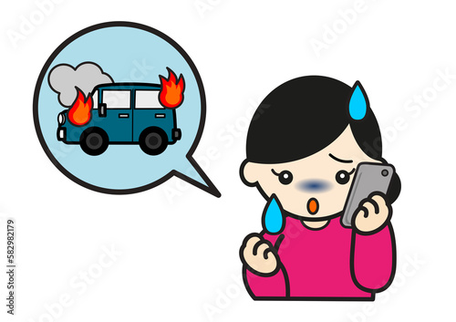 車の火災にについて電話する女性 photo