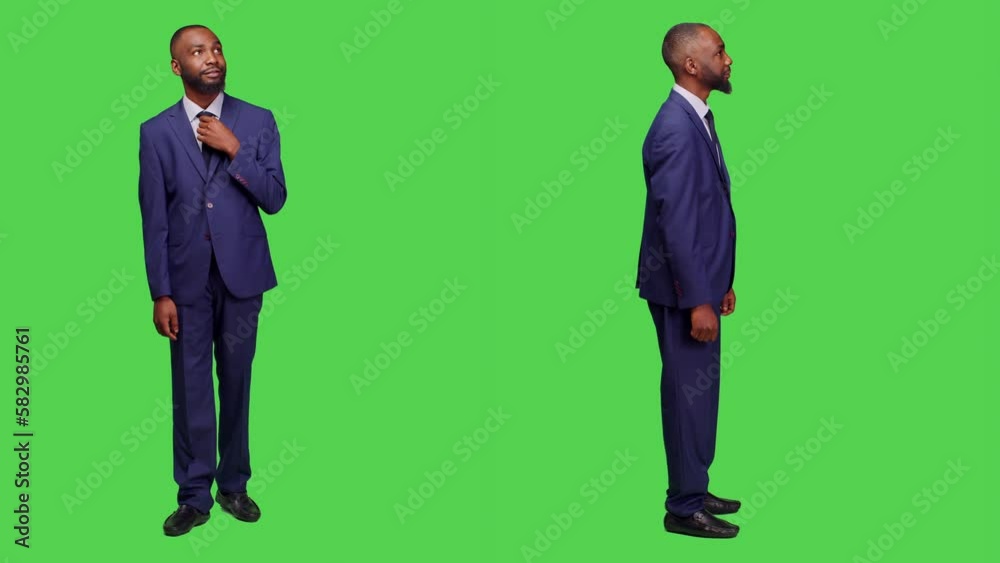 Young startup manager being amazed and shocked, feeling confident in formal office suit over full body green screen. Surprised company worker in awe seeing something on camera. Young startup manager being amazed and shocked, feeling confident in formal office suit over full body green screen. Surprised company worker in awe seeing something on camera.