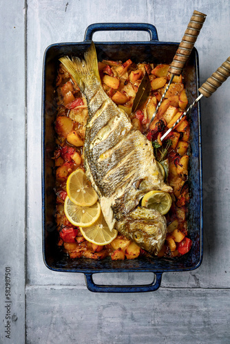 baked snapper on a bed of vegetable