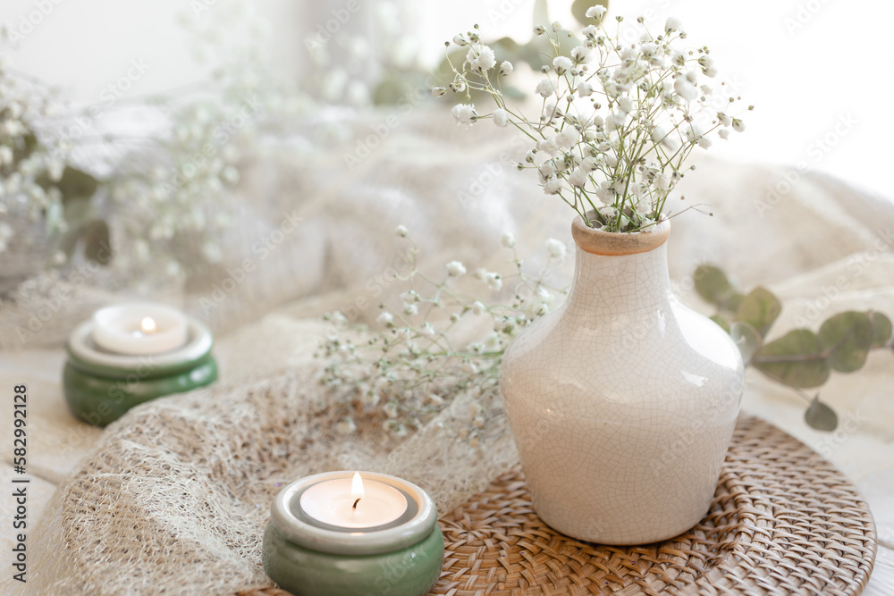 Spring composition with gypsophila flowers and candles. Spring composition with gypsophila flowers and candles.