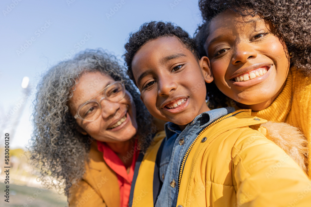 Happy multi-generation family having fun in park