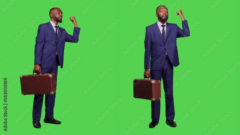 Company employee with suitcase hitchhicking on camera and doing gestures with hand over full body greenscreen. Optimistic businessman in suit waving to travel, briefcase luggage. Company employee with suitcase hitchhicking on camera and doing gestures with hand over full body greenscreen. Optimistic businessman in suit waving to travel, briefcase luggage.