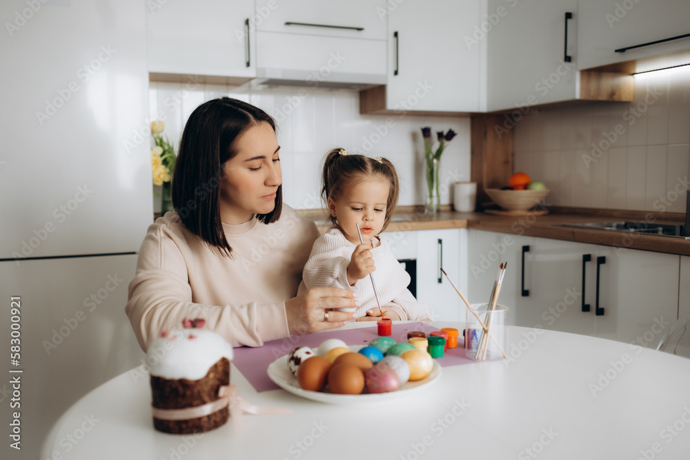 Happy easter. A mother and her daughter painting Easter eggs. Happy easter. A mother and her daughter painting Easter eggs.
