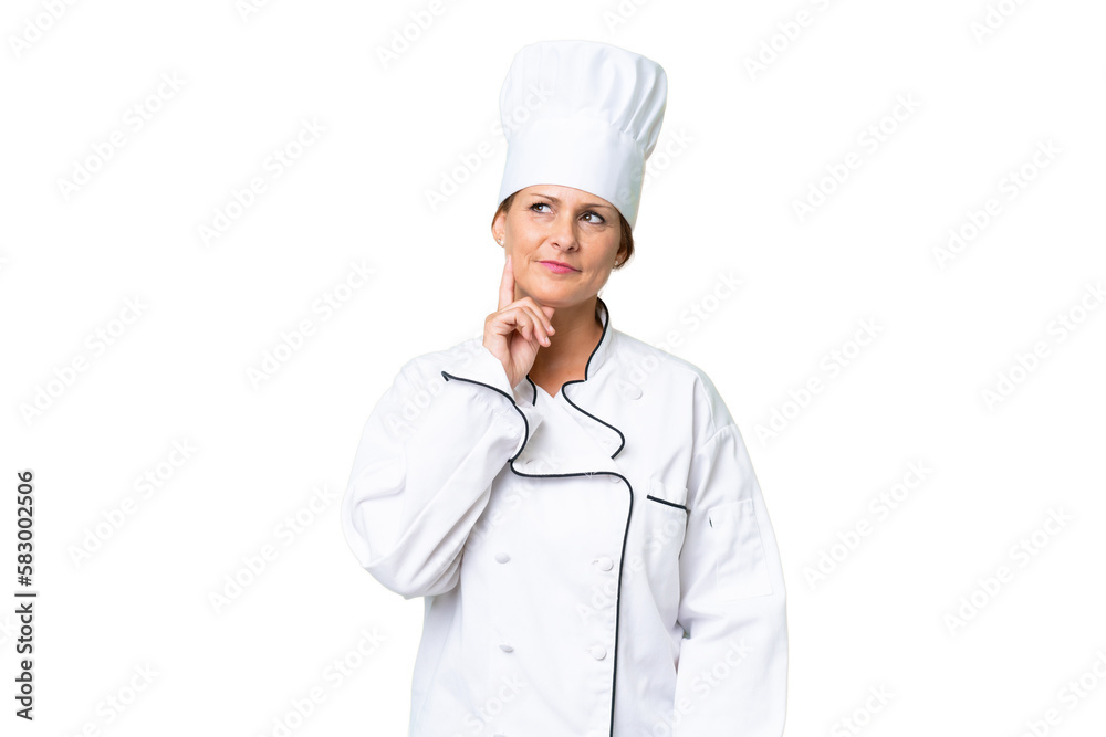 Middle-aged chef woman over isolated background thinking an idea while looking up Middle-aged chef woman over isolated background thinking an idea while looking up
