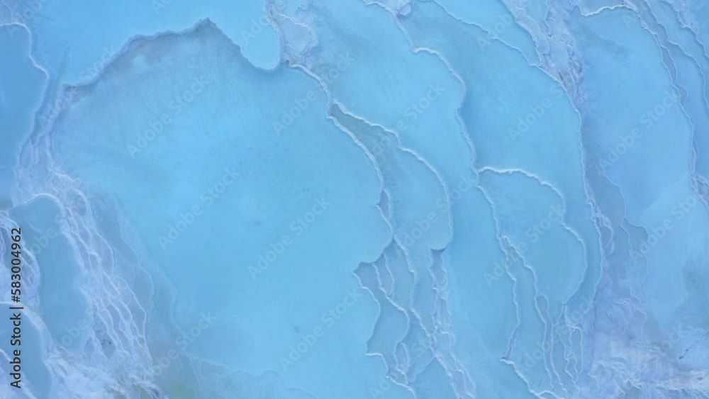 Aerial view of Pamukkale geothermal springs, travertine terraces. White limestone mineral formations. 4K Aerial view of Pamukkale geothermal springs, travertine terraces. White limestone mineral formations. 4K