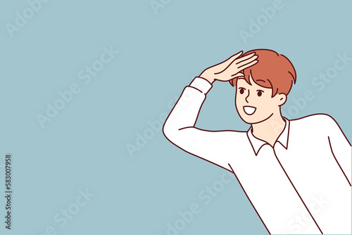 Boy looks out and puts hand to forehead to look into distance and find interesting offer or close person. Positive teenage boy smiling and playing spy or detective watching friends 