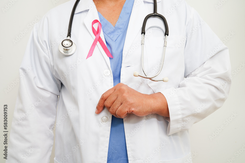 Asian woman doctor with pink ribbon, World Breast Cancer Day at October. Asian woman doctor with pink ribbon, World Breast Cancer Day at October.