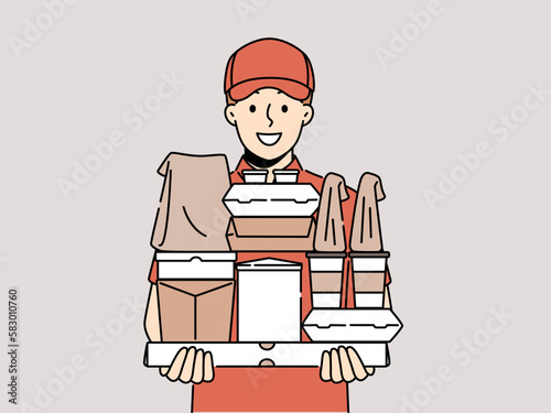 Smiling male courier with boxes in hands show good quality service. Happy deliveryman in uniform deliver order to customer. Vector illustration. 