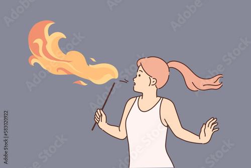 Woman blow fire with mouth 