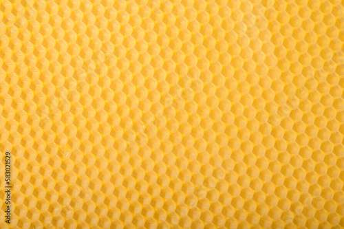 Beeswax honeycomb candle sheet close up background