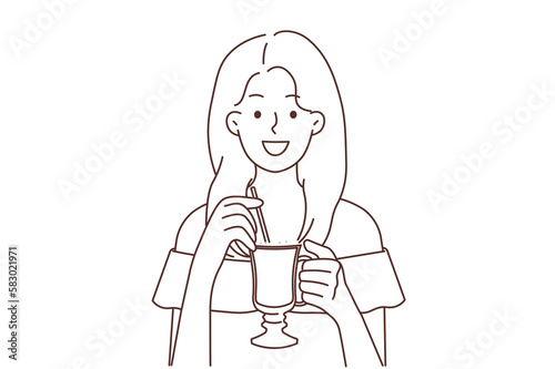 Smiling woman drinking late coffee with straw