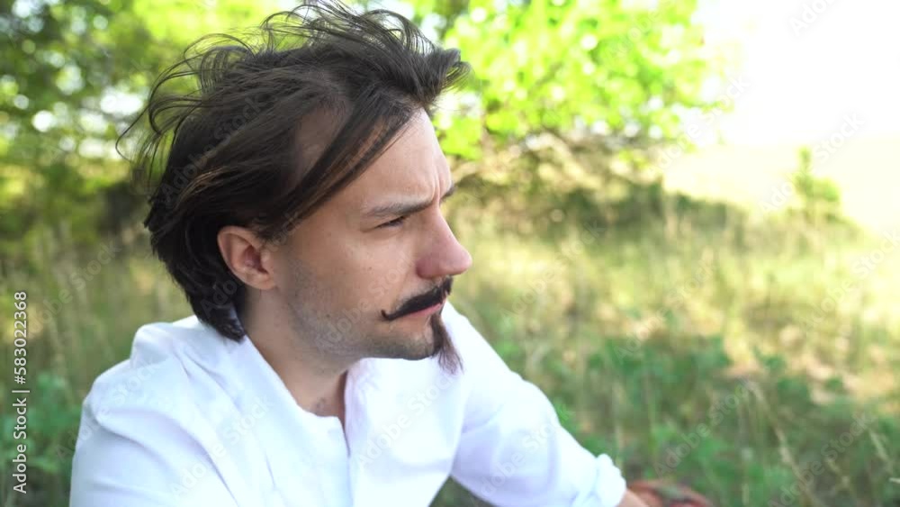 Hungarian poet Sandor Petofi eating snack, resting in shade. Close up profile. Hungarian poet Sandor Petofi eating snack, resting in shade. Close up profile.