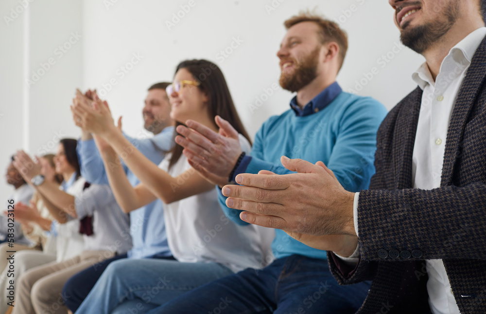 Group of people applauding. Happy audience clapping hands at public