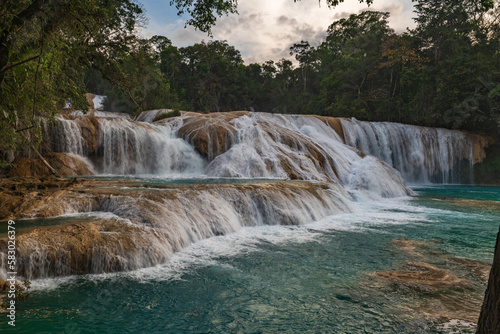 The Agua Azul waterfalls  a series of cascades of varying heights and widths  get their name from the colour of the water  which has a bright blue hue when accumulated Mexico.