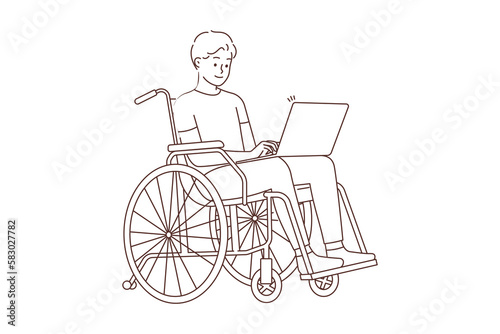 Smiling man in wheelchair work on computer 