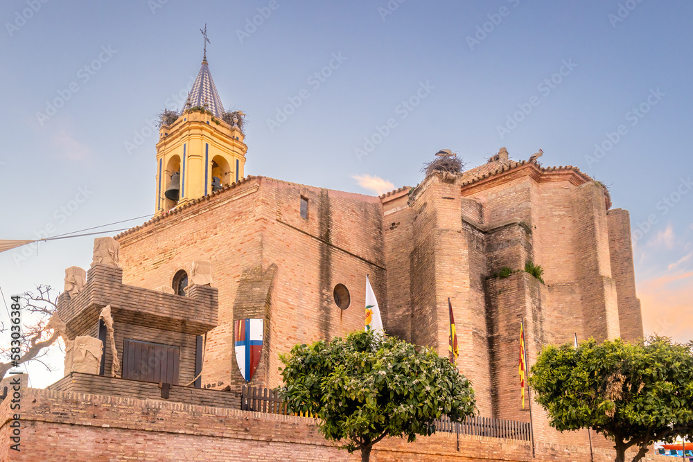 Church of San Jorge Martir, Saint George Martyr, at sunset, in the municipality of Palos de la Frontera, decorated for the celebration of the Medieval Discovery Fair, in Huelva, Andalusia, Spain
