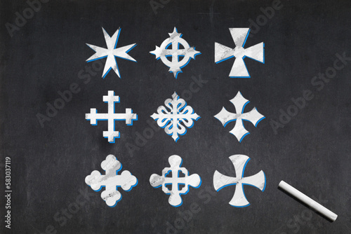 Nine crosses of different shapes drawn on a blackboard