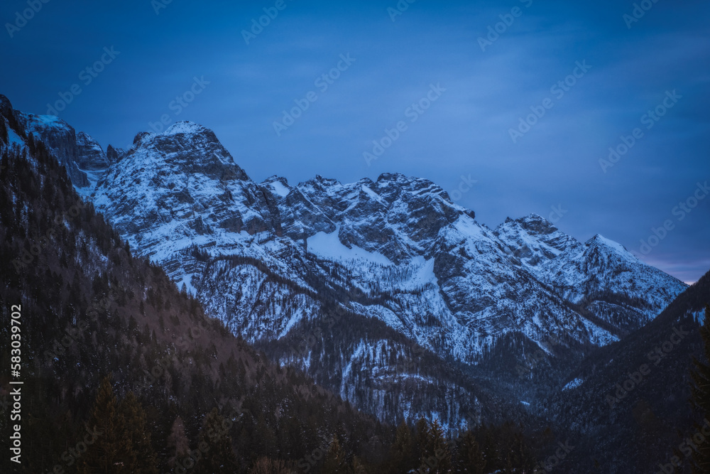 Ski resort Madonna di Campiglio at night. Panoramic landscape in the winter time of the Dolomite Alps in Madonna di Campiglio. Northern and Central Brenta mountain groups, Italy. January 2023