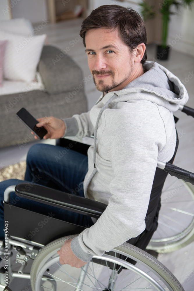 disabled man watching sports on tv disabled man watching sports on tv