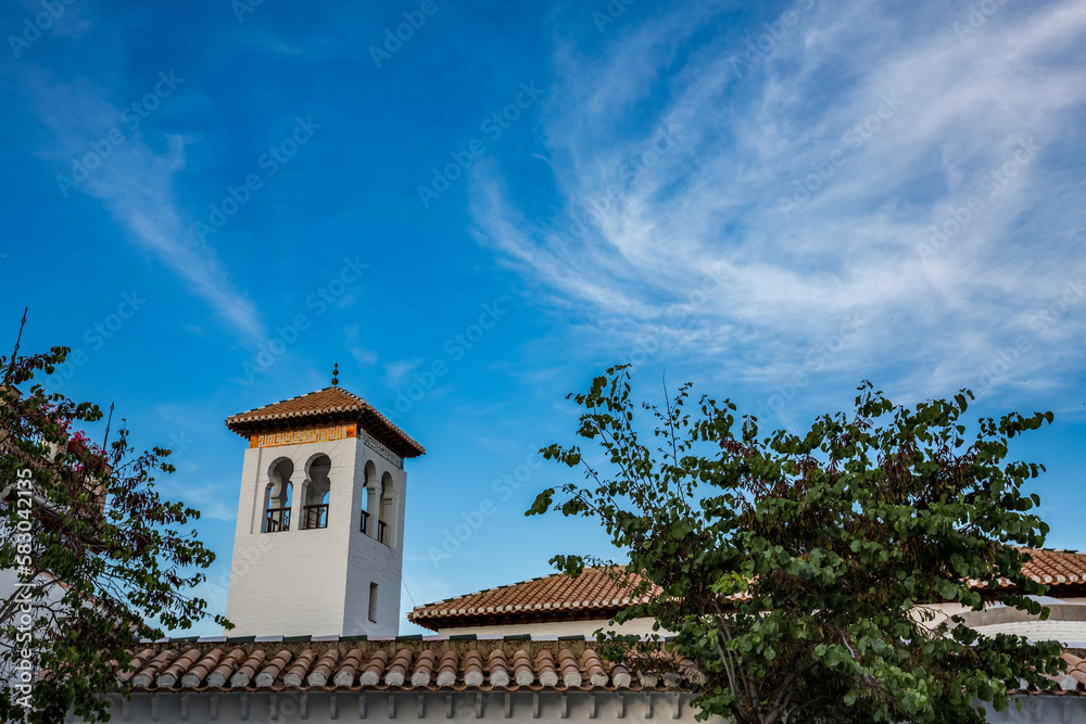 Wonderful city sky, Granada, Andalusia, Spain, tower over the roofs Wonderful city sky, Granada, Andalusia, Spain, tower over the roofs