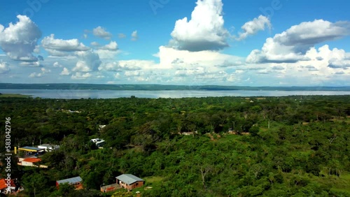 Aerial View Of Ypacarai Lake And Aregua City Covered With Green Trees, Paraguay photo