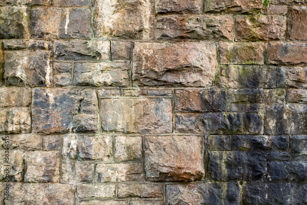 Stone wall, abstract texture for design. Stone mason craft and skill. Old building material with long use life. Stone wall, abstract texture for design. Stone mason craft and skill. Old building material with long use life.