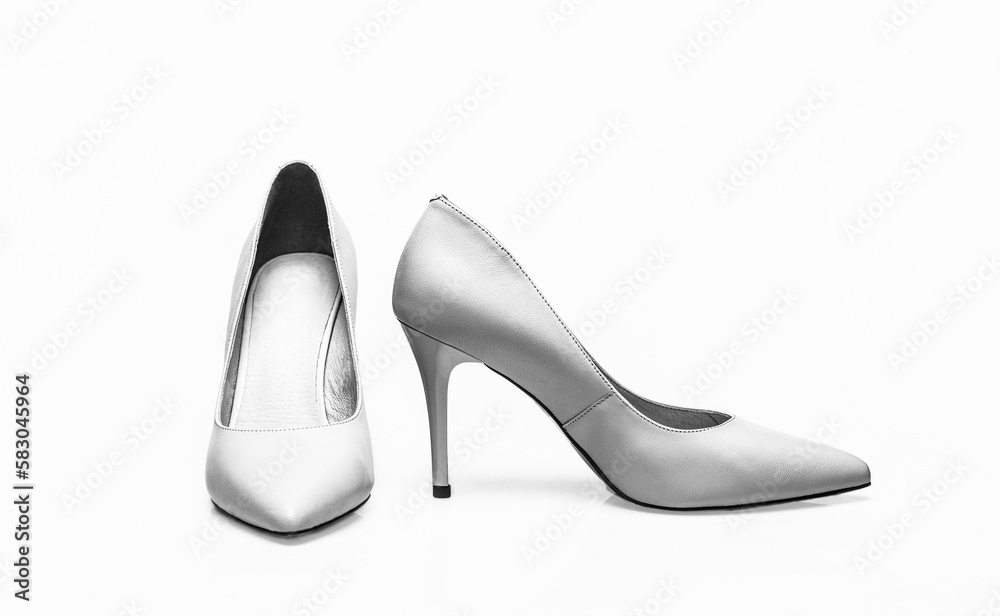Stylish classic women leather shoe. Fashionable women shoes isolated on white background. White high heel women shoes on white background Stylish classic women leather shoe. Fashionable women shoes isolated on white background. White high heel women shoes on white background