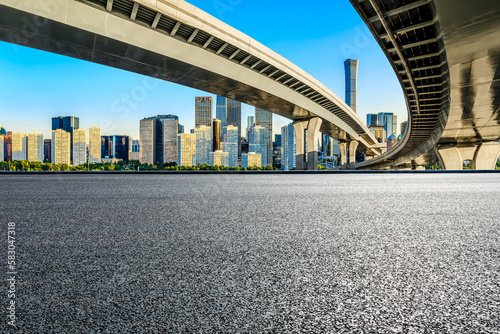 Asphalt highway and viaduct with the city skyline in Beijing, China.