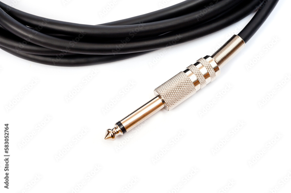 Long black jack cord for electric guitar, filmed on a white background. Long black jack cord for electric guitar, filmed on a white background.