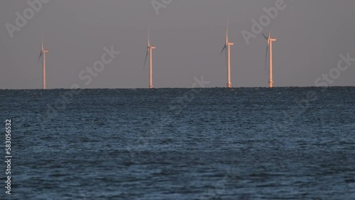 Wind turbines of the massive Dogger Bank wind farm shot from long distance photo