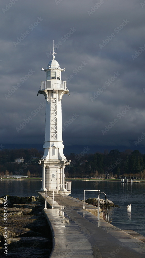 A tower in the heart of the lake by the Port of Geneva fountain
