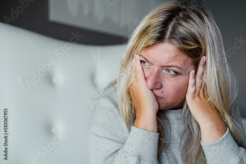 Unhappy woman thinking about health problems. Mental health overweight problems. photo