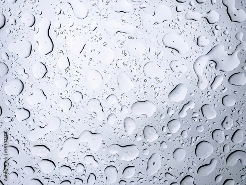 Raindrops on the window close-up, abstract natural background.