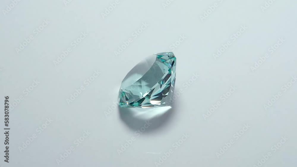 A full 360 degrees video of Obsedian gemstone in light mint green color with a Spinner design, placed on a turntable covered with white Photopaper A full 360 degrees video of Obsedian gemstone in light mint green color with a Spinner design, placed on a turntable covered with white Photopaper