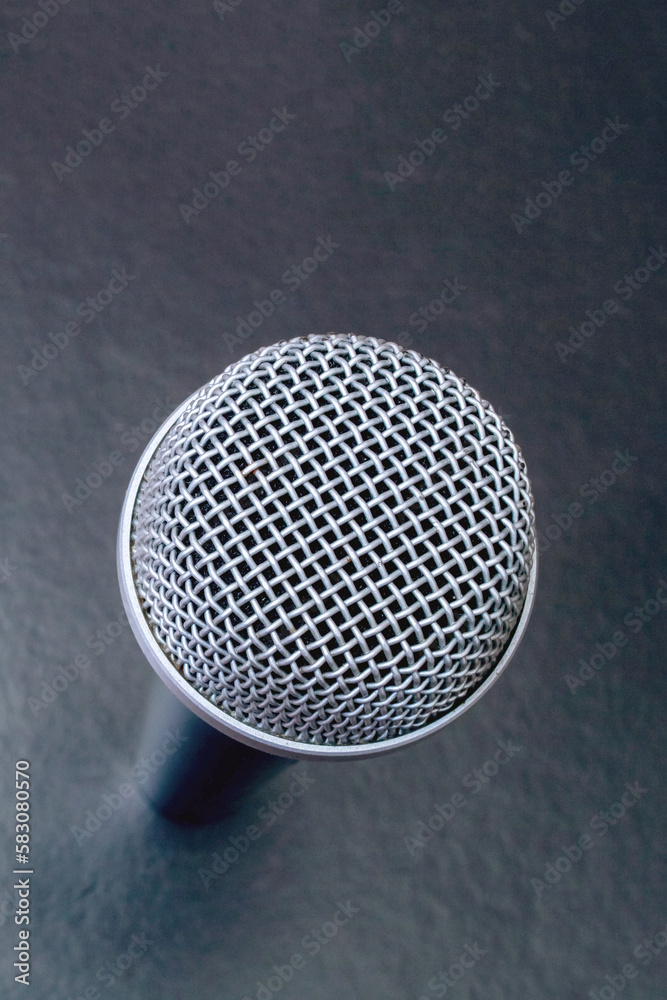 Microphone on black background top view closeup Microphone on black background top view closeup