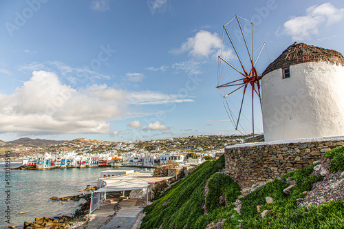 The famous windmills in Mykonos, Cyclades Greece with vew of Little Venice