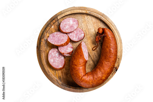 Bavarian Smoked sausage on a wooden board with herbs.  Isolated, transparent background. photo
