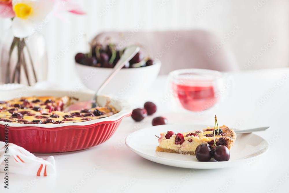 Plate with tasty cherry cheesecake pie on white background Plate with tasty cherry cheesecake pie on white background