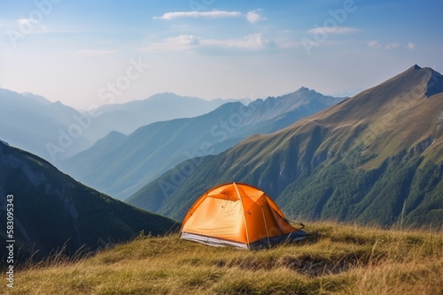 A camping tent on a mountain with wide panorama view and blue sky. Concept of travel adventure and hiking.