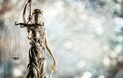 Law and legal background concept statue of Lady Justice with scales of justice