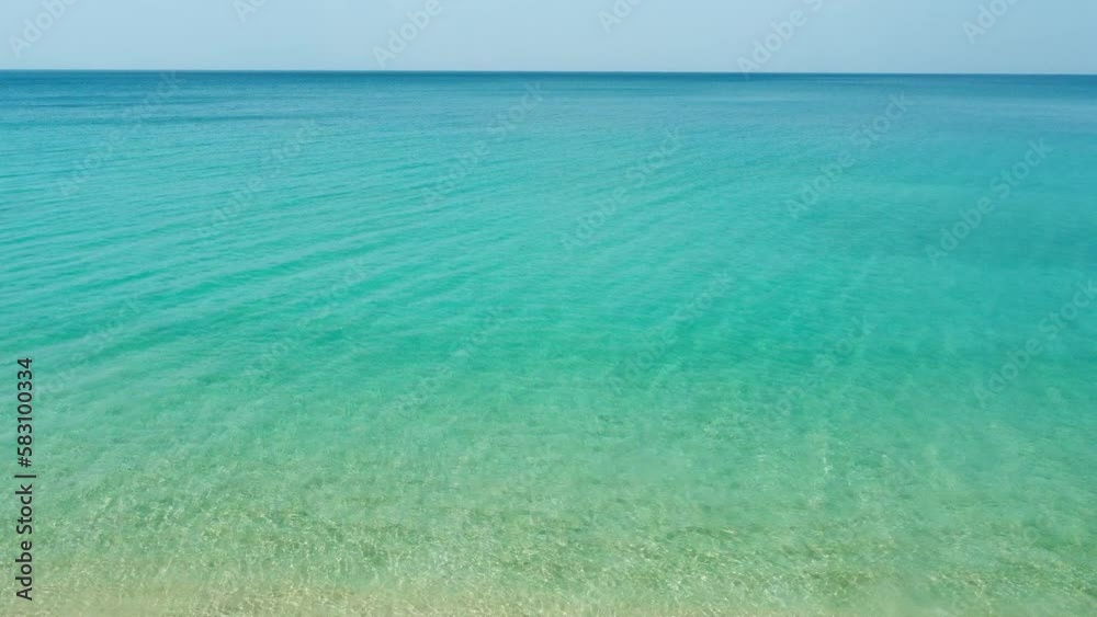 Top view of beautiful tropical beach seamless loop footage. Amazing Sandy coastline with white turquoise sea waves. Drone moving forward over sea. Top view of beautiful tropical beach seamless loop footage. Amazing Sandy coastline with white turquoise sea waves. Drone moving forward over sea.