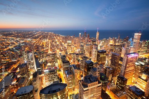 Chicago, Illinois USA aerial skyline towards Lake Michigan just after sunset.