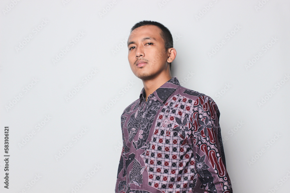 An Asian man wearing Javanese traditional clothes batik from Indonesia An Asian man wearing Javanese traditional clothes batik from Indonesia