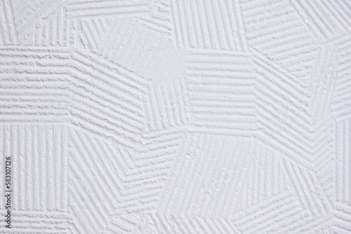 white plaster wall background with abstract decorative pattern