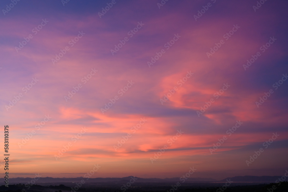 Evening time of panorama mountain under dramatic twilight sky and cloud. Nightfall Silhouette mountain on sunset.