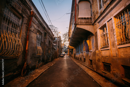 Old shabby houses in the slum district at Tbilisi at night