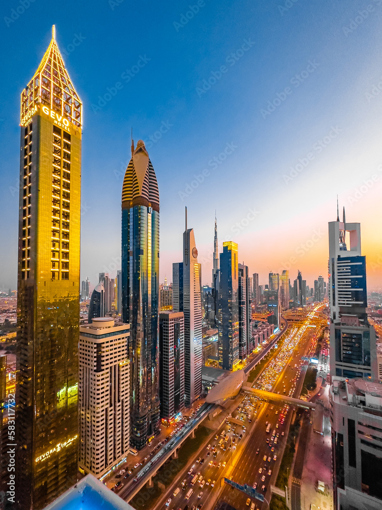 Fototapeta premium View of Sheikh Zayed Road at sunset in Dubai Downtown Financial center, UAE