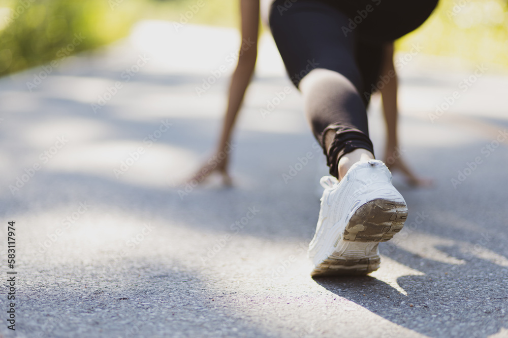 Athlete runner running woman on street in public park. Athlete runner running woman on street in public park.