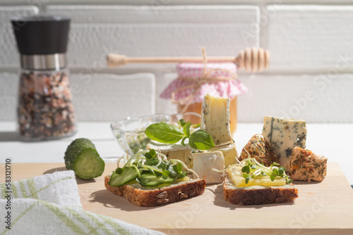 Freshly made vegetarian sandwich with alfalfa sprouts and cheese photo