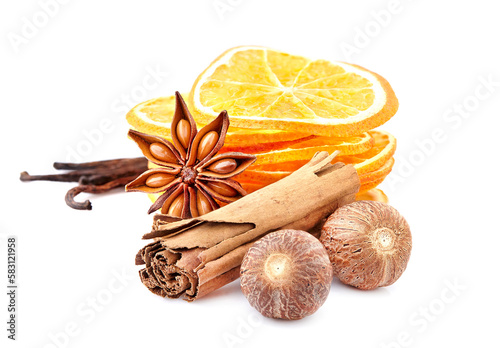 Dry oranges with  cinnamon, nutmeg, anise  and vanilla on white background closeup. Citrus slices with spices.